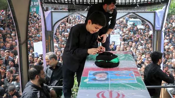 Iran: Late president Ebrahim Raisi laid to rest in holy city of Mashhad