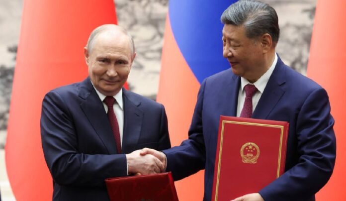 Putin tells Xi Russia-China